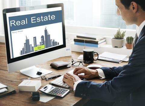 Person on computer looking at a real estate mortgage website