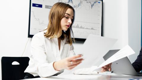 Person comparing documents