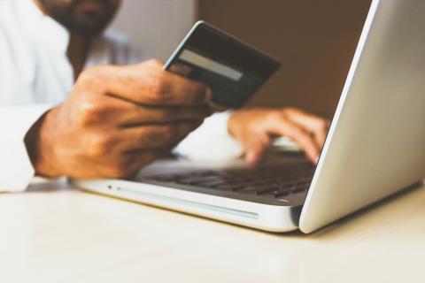 Person looking at credit card