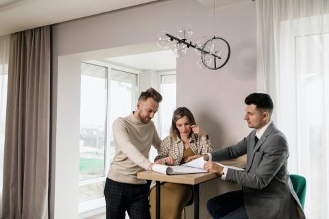 Real estate agent showing documents