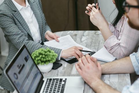 People reviewing documents