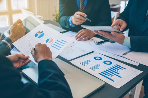 Group of people reviewing charts