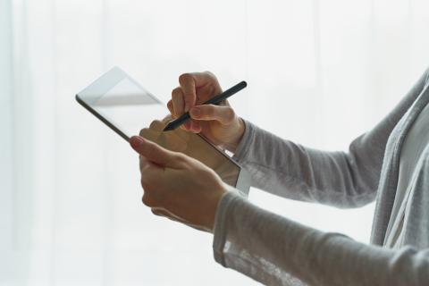 Person reviewing document on a tablet